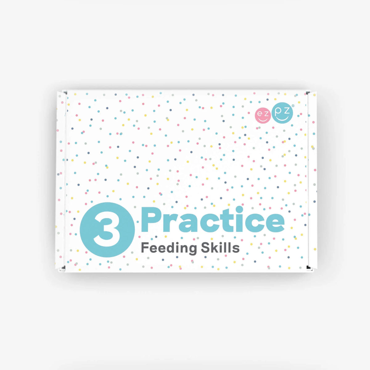 A white rectangular box with pastel confetti dots and the text '3 Practice Feeding Skills' in teal and gray, photographed on a light gray background.