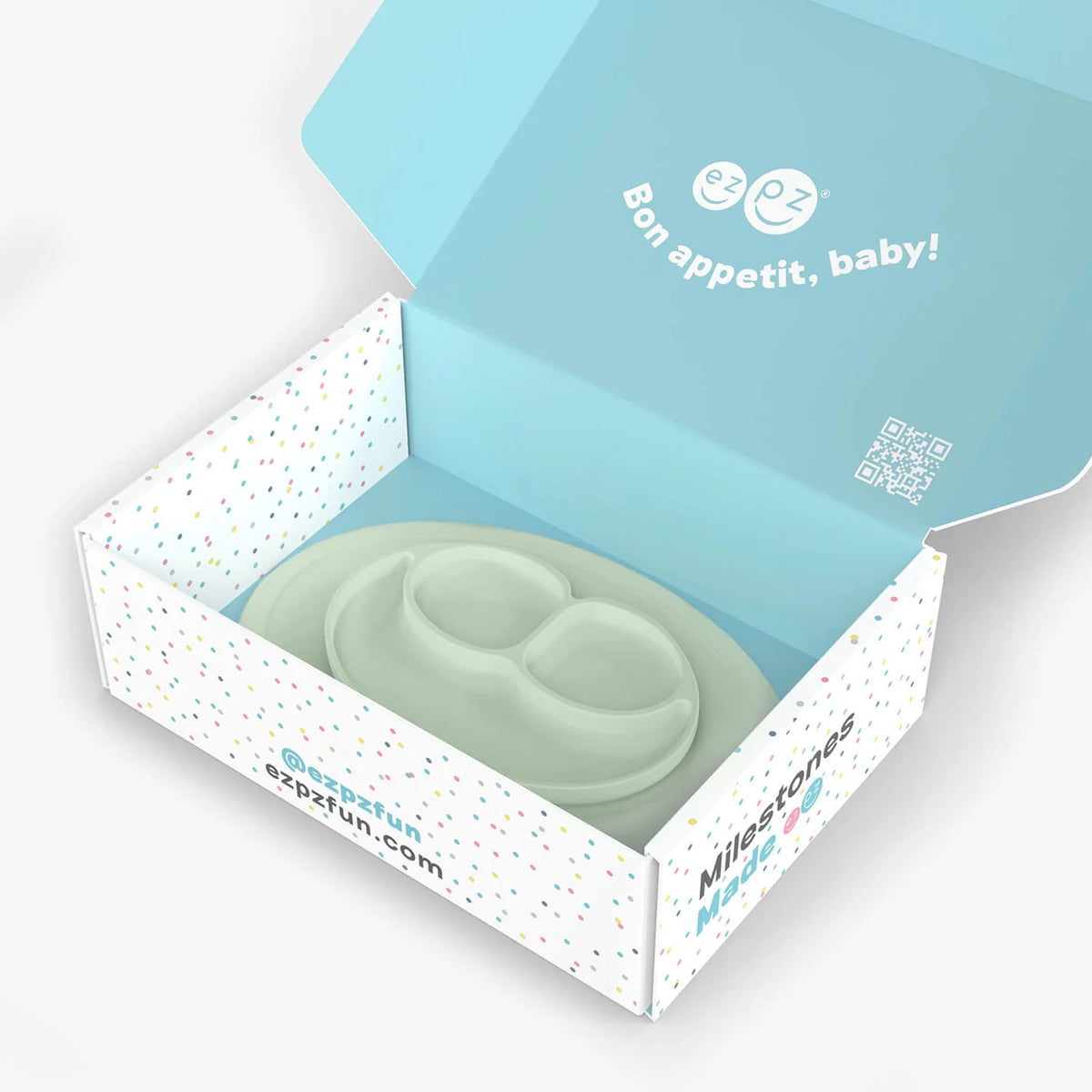 Green baby teether in a branded box with 'Bon appetit, baby!' text.