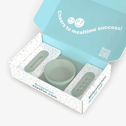 Silicone utensils set in a branded box with 'Cheers to mealtime success!' text.