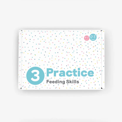 A white rectangular box with pastel confetti dots and the text '3 Practice Feeding Skills' in teal and gray, photographed on a light gray background.