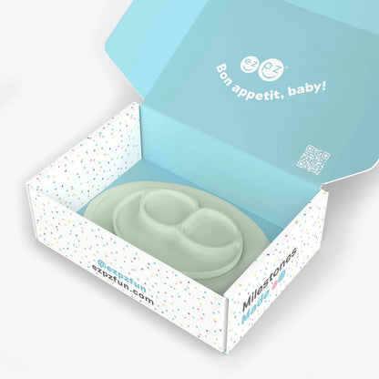 Green baby teether in a branded box with 'Bon appetit, baby!' text.