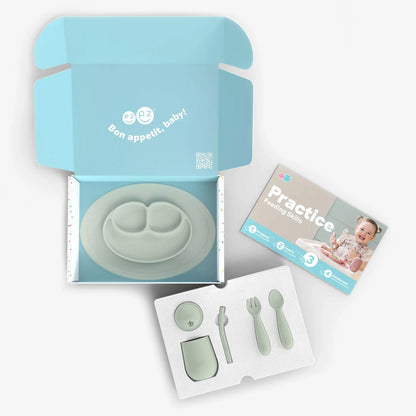 Baby feeding utensils set with packaging and instructions on a white background